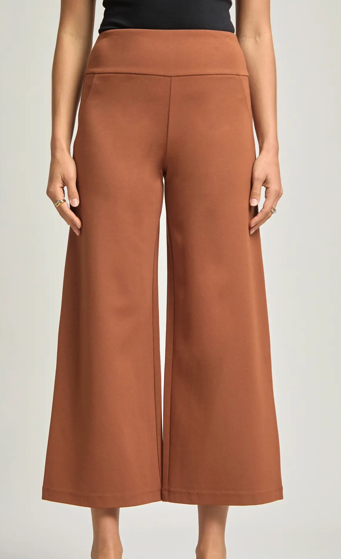 Rust cropped wide leg pants with pull-on waistband, shown on model