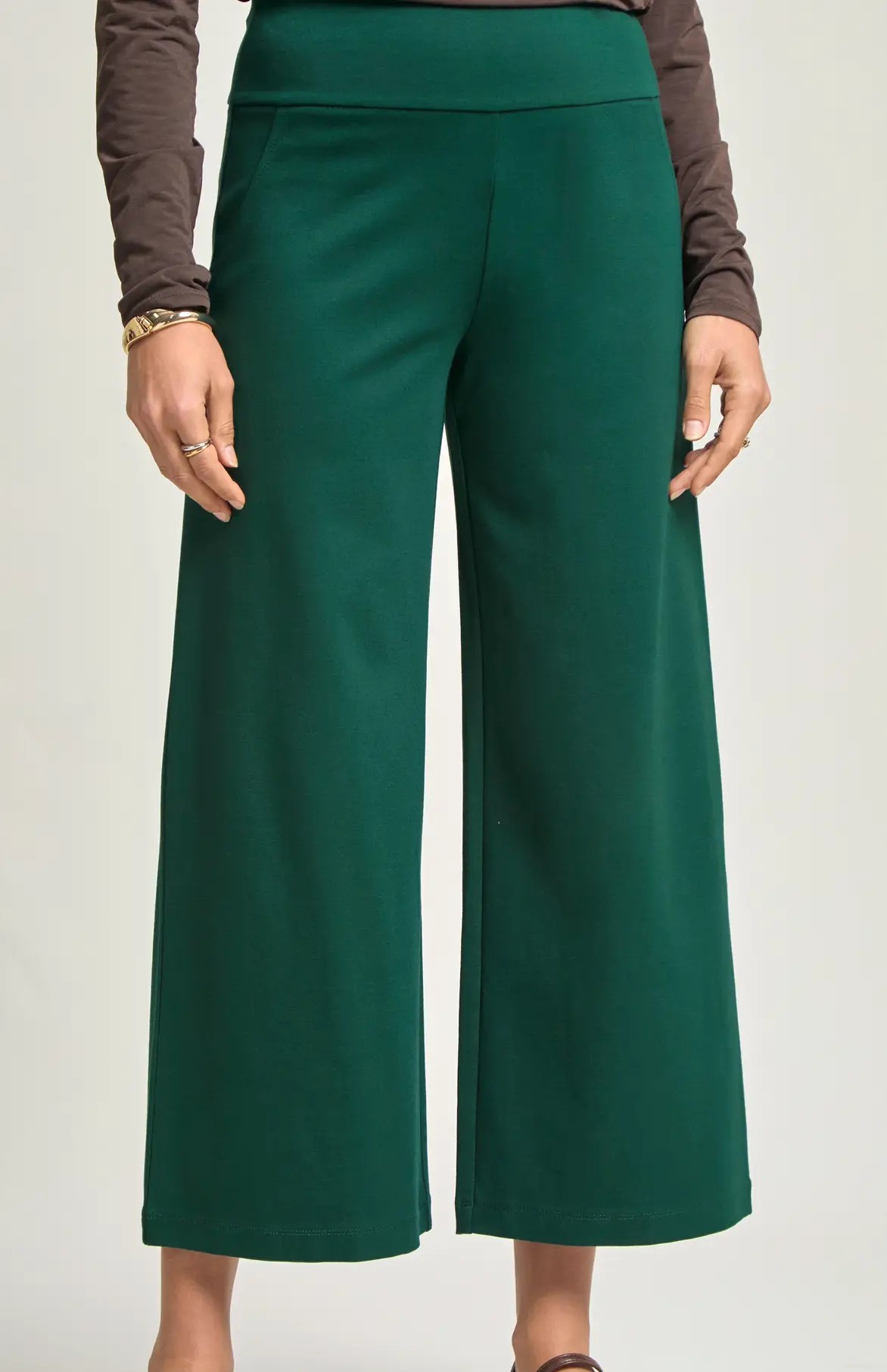Hunter green cropped wide leg pants with pull-on waistband, shown on model