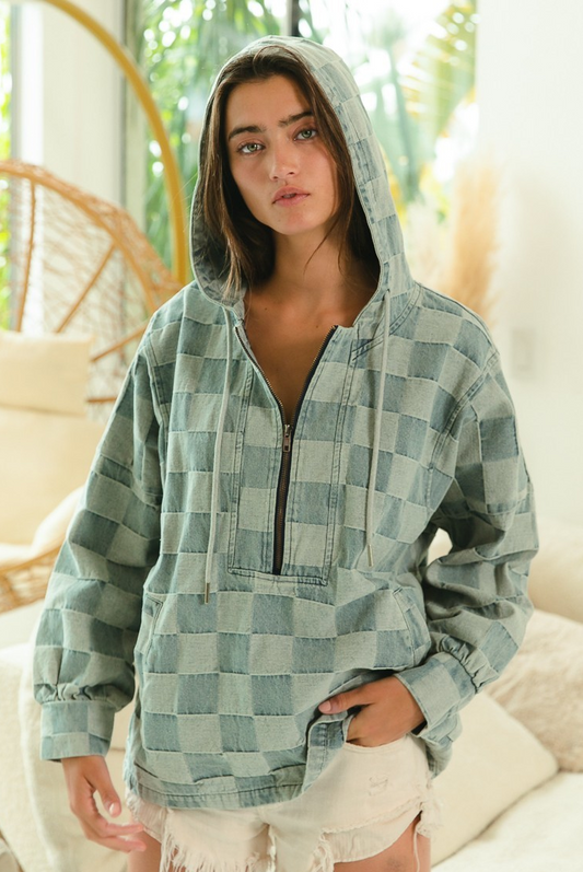 Model wearing washed denim check hoodie with half-zip front, hood, and kangaroo pocket.