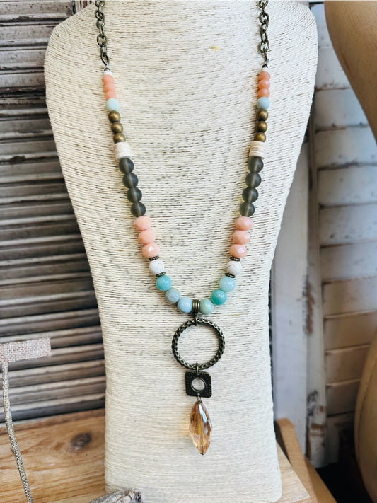 Boho style 30" beaded necklace with Amazonite, Howlite, glass beads, bronze pendant, and crystal drop

