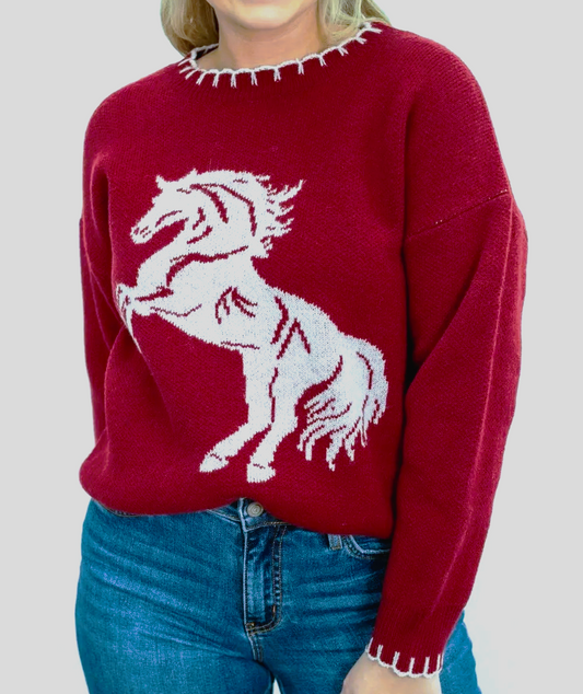 Dark red knit sweater featuring a white horse graphic and contrast stitched neckline and cuffs.