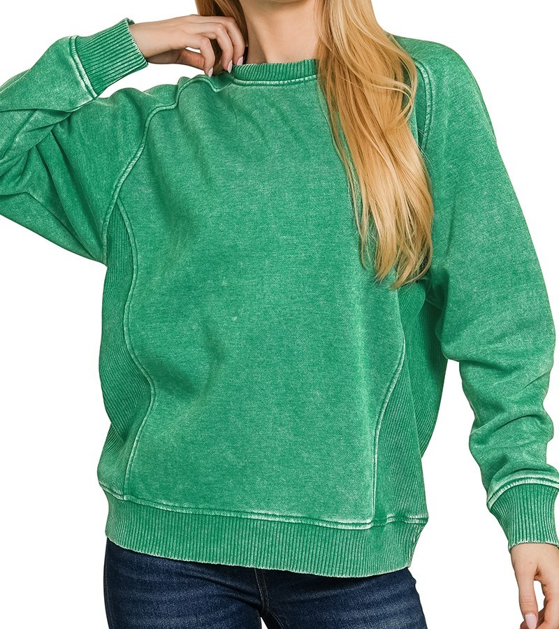 Green acid-washed fleece top with ribbed side panels, relaxed fit, and long sleeves.