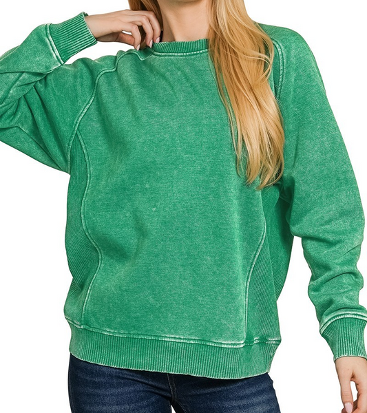 Green acid-washed fleece top with ribbed side panels, relaxed fit, and long sleeves.