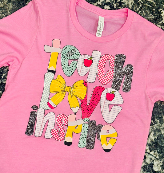 “Teach Love Inspire” Teacher Graphic Tee – Pink