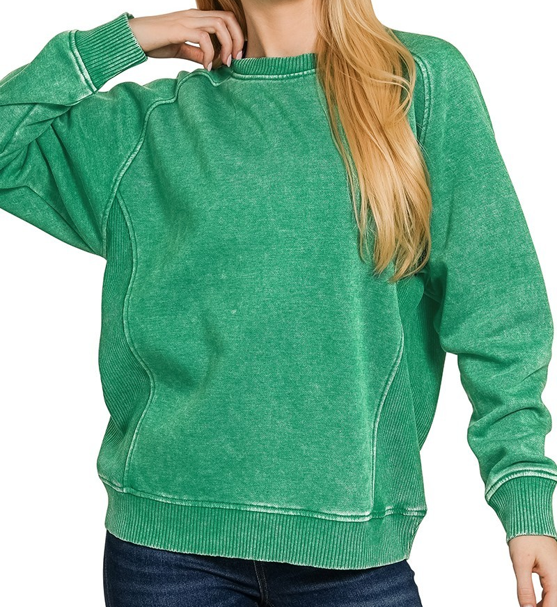Acid washed fleece pullover with ribbed side panels, relaxed fit, and soft textured fabric.