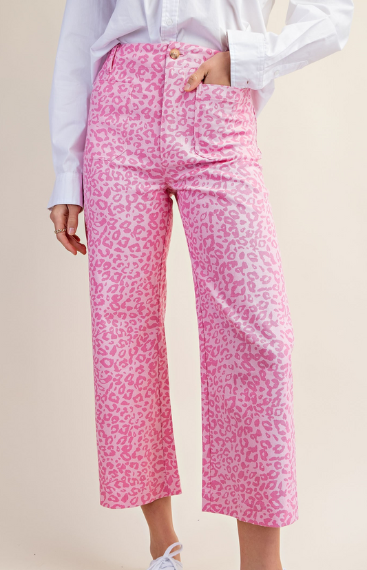 Cropped high-rise pink pants with hot pink leopard print and front patch pockets.