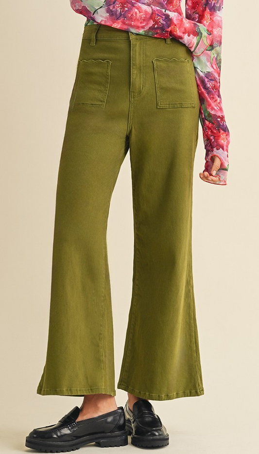 Olive wide-leg high-rise pants with scalloped front pockets, shown with black flats.