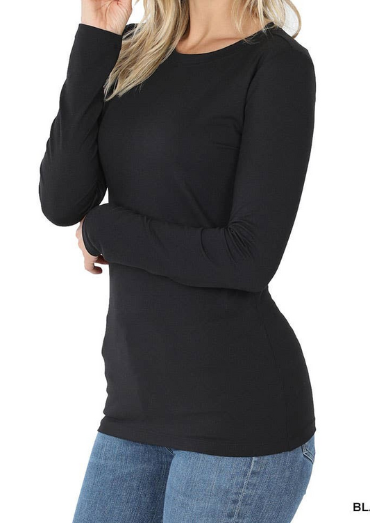 Woman wearing black brushed microfiber crew neck long sleeve tee with slim fit and stretchy fabric.